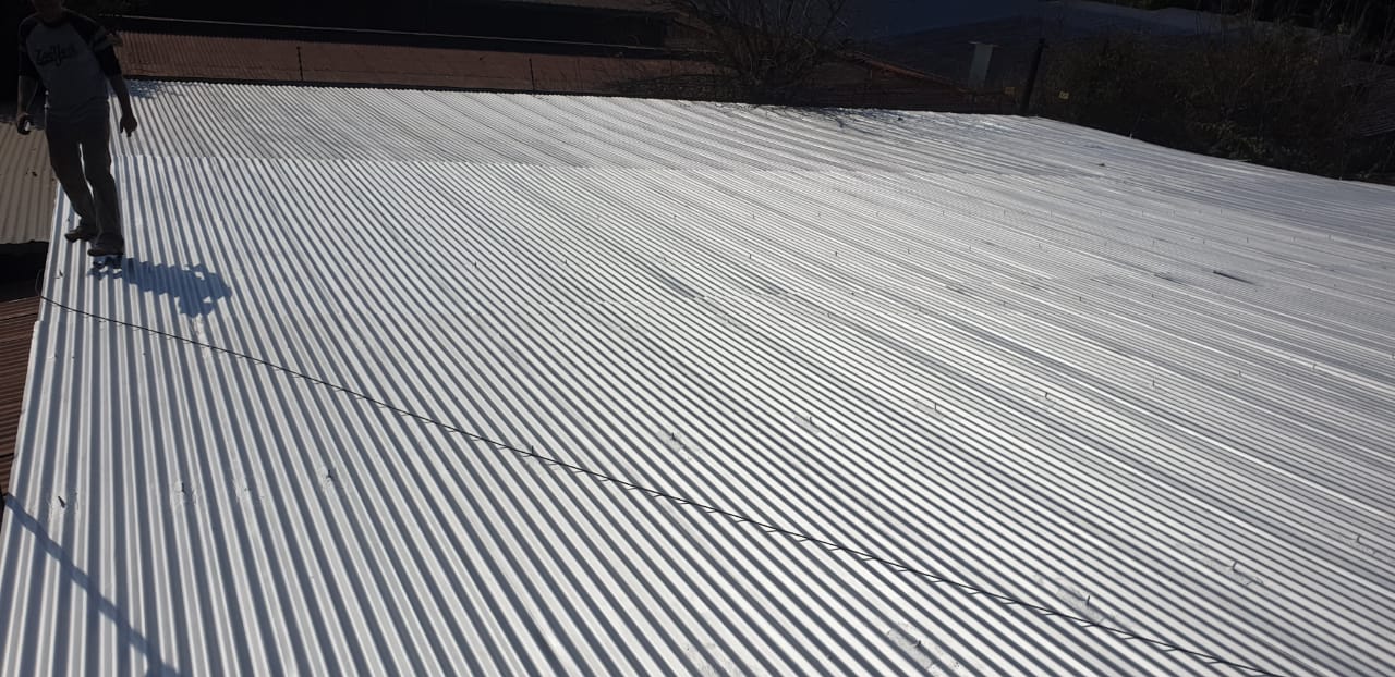 Completed roof coating project by Fix & Flo